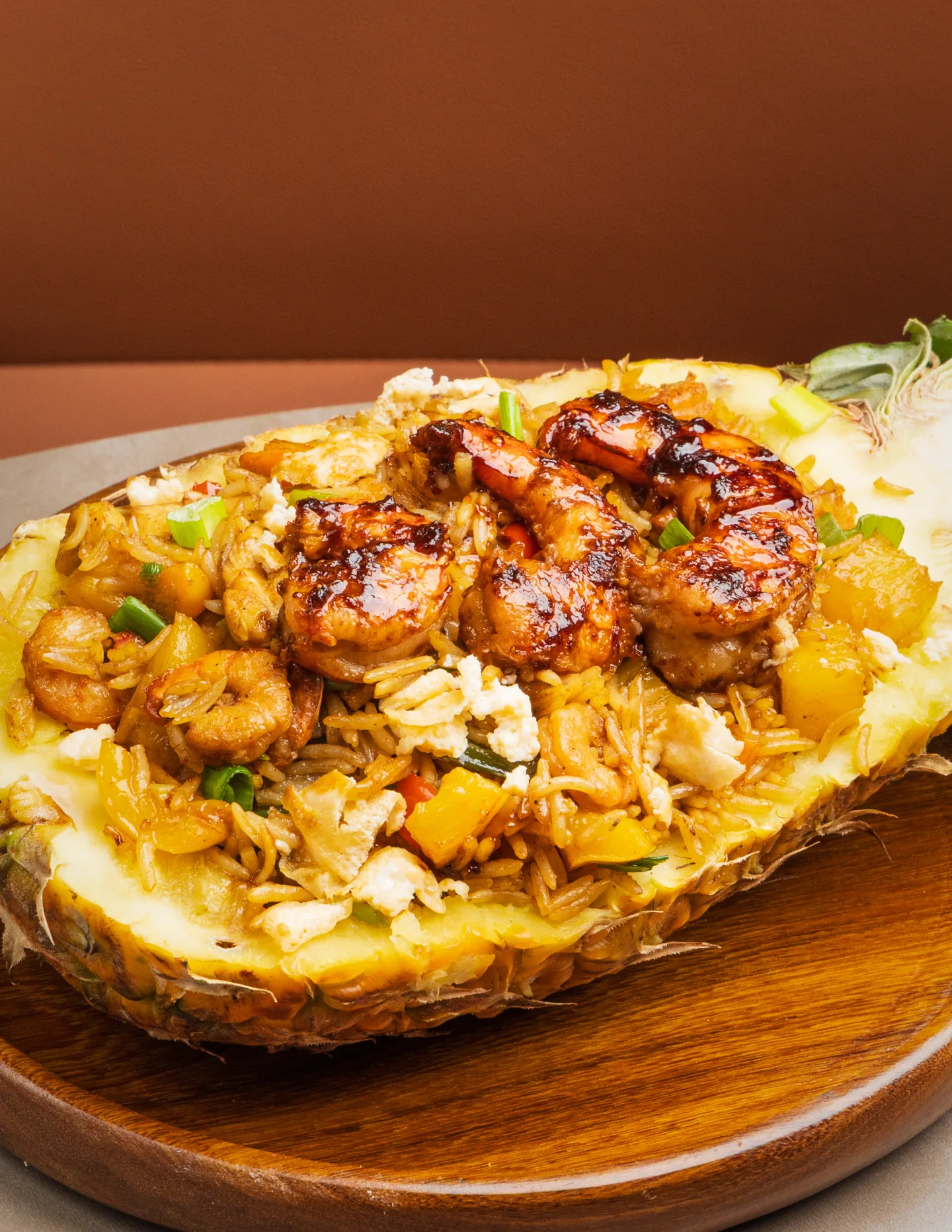 Evenana pineapple rice served in a fresh pineapple